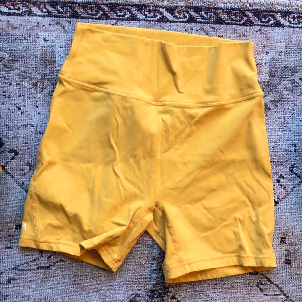 Acta Wear medium sunflower color biking shorts. Made from recycled material.